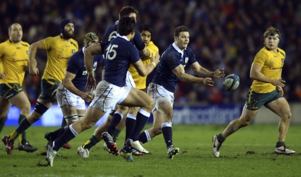 Duncan Taylor of Scotland tries to out run pressure from the Australian forwards (2013)